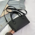 Chic black litchi pattern mini bucket bag with adjustable crossbody strap and silver hardware - Black without Pendant
