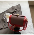 Detail of red and dark brown patchwork pillow bag with gold scallop buckle and strap - Red
