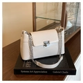 Detail of cream patent leather shoulder bag with glossy crinkle texture and silver chain - White