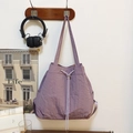 Sac à dos violet à cordon en nylon texturé avec poches latérales pratiques - Violet