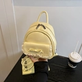 Kleiner hellgelber Damenrucksack mit Spitzen-Tasche und dekorativer Schleife - Gelb