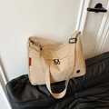 Khaki large capacity nylon tote bag with adjustable strap and circular zipper detail - Khaki
