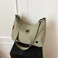 Light green nylon shoulder bag with zipper pocket and wide strap for casual travel - Green