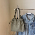Olive green drawstring nylon tote bag with utility pockets and worker style design - Green
