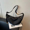 Minimalist black crescent canvas crossbody bag with adjustable strap and leather accents - Black