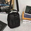 Chic black drawstring bucket bag with adjustable nylon strap for urban casual style - Black