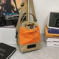 Fashionable khaki and orange color-block bucket bag with adjustable wide strap and drawstring - Khaki and Orange