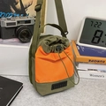 Water-resistant army green and orange nylon bucket bag with adjustable strap - Green and Orange