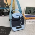 Blue nylon drawstring bucket bag with adjustable wide strap and top handle - Blue