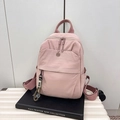 Minimalist light pink nylon backpack with dual zippers and smiley face pendant charm - Pink
