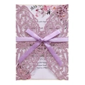 Detail view of laser-cut glitter butterfly wedding invitation with a satin ribbon bow - Glitter Lavender
