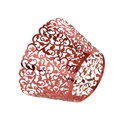 Macro shot of laser-cut red mirror finish cupcake wrappers with elegant filigree patterns - Mirror Apple Gold