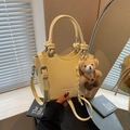 Pale yellow crossbody bucket bag with crocodile texture and cute teddy bear charm - Yellow with Pendant