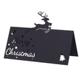 Détail macro du marque-place de Noël noir découpé au laser avec renne et texte festif - Noir