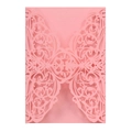 Detail of pink laser-cut butterfly and floral patterns on an elegant wedding invitation - Pink