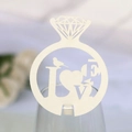 Close-up of laser-cut paper wine glass card in diamond ring shape with LOVE heart design - Ivory