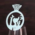 Detail view of mint green laser-cut diamond ring card with LOVE text on wine glass edge - Pearl Pale Blue