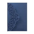 Detailed macro view of laser-cut intricate vine patterns on dark blue cardstock - Magic Blue