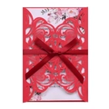 Detail of red laser cut wedding invitation with ribbon bow and floral inner page - Pearlescent Red
