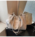 Detail of cream leather tote bag featuring embossed texture, pearl chain and cloud pendant - Off White