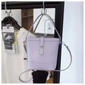 Detail of lavender bucket bag with crocodile texture and silver metal twist lock - Purple