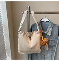 Detail of canvas bucket bag with QZBG leather tag and cute brown plush bear pendant - Beige With Pendant