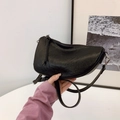 Minimalist black crescent hobo bag with pebble leather texture and silver zipper detail - Black