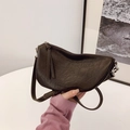 Dark brown minimalist half-moon crossbody bag with textured faux leather finish - Brown