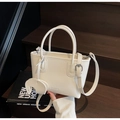 Detail of white lychee leather handbag with silver hardware and elephant charm - Elephant Charm Style / Off-white
