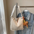 Beige canvas bucket bag with adjustable strap and cute brown plush bear charm accessory - Beige with Charm