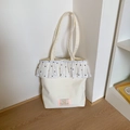 Borsa tote in tela bianco avorio con volant a pois e dettaglio etichetta rosa - Bianco
