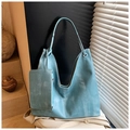 Detail of light blue hobo tote bag with vintage texture and matching detachable pouch - Lake Blue