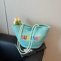 Lake blue woven tote bag with summer embroidery and stylish rope handles for beach trips - Green