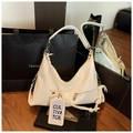 Chic cream white glossy hobo bag with a woven knot strap and silver zipper detail - White