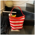Red and white striped knit hobo bag with red leather handle and metal ring details - Red