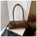 Detail of dark brown leather baguette shoulder bag with dual zipper and vintage finish - Brown