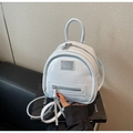 Detail of light blue mini backpack with adjustable straps and decorative front zip metal tag - Blue