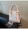 Detail of pink and gray crossbody bag with geometric texture and silver buckle accents - Pink