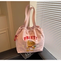 Close-up of pink tote bag featuring cute bear embroidery and decorative ruffle edges - Pink (Style 2)