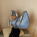 Light blue denim half-moon underarm bag with silver trim and cute plush bear charm - With Charm / Blue