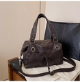 Detail of dark brown faux leather tote with metal ring and drawstring pocket design - Brown