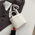 White quilted bucket bag with adjustable shoulder strap and stylish PANTOR brand logo - White