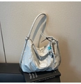 Detailed close-up of a silver hobo bag with textured nylon fabric and a cute dog charm - Silver (With Pendant)
