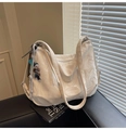 Macro detail of white marble texture and logo on premium PU leather hobo shoulder bag - Beige With Charm