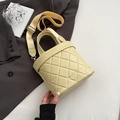 Chic quilted cream yellow bucket bag with a wide adjustable canvas strap for daily commute - Yellow
