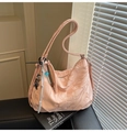 Close-up of pink marble tote bag with logo patch and decorative trendy pendants - Pink with Pendant