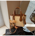 Mini cream bucket bag with brown trim and cute embossed puppy design and charm - With Charm / Off White