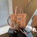 Light pink woven texture handbag with detachable strap and elegant lace bow charm - Pink with Pendant
