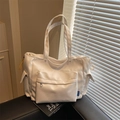 Stylische weiße Nylon-Tragetasche mit viel Platz, mehreren Taschen und gelben Kordeln - Gebrochenes Weiß