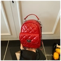 Mini red quilted backpack with metallic turn-lock closure and silver chain strap - Red